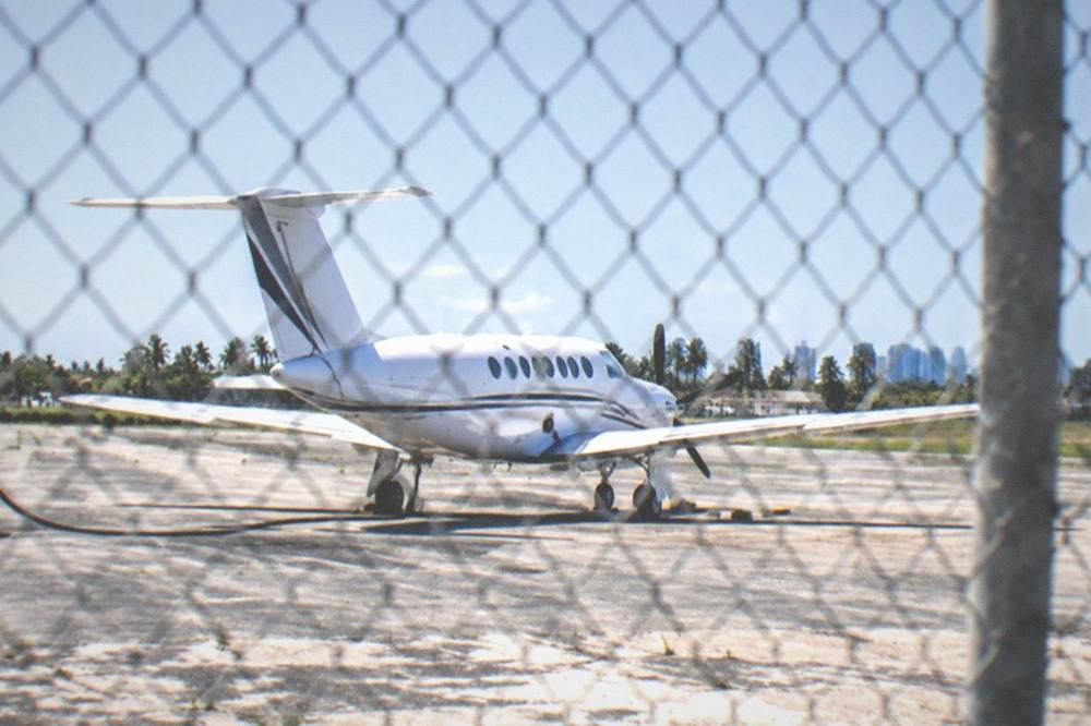 Small commercial aircraft on a runway at a South Florida airport