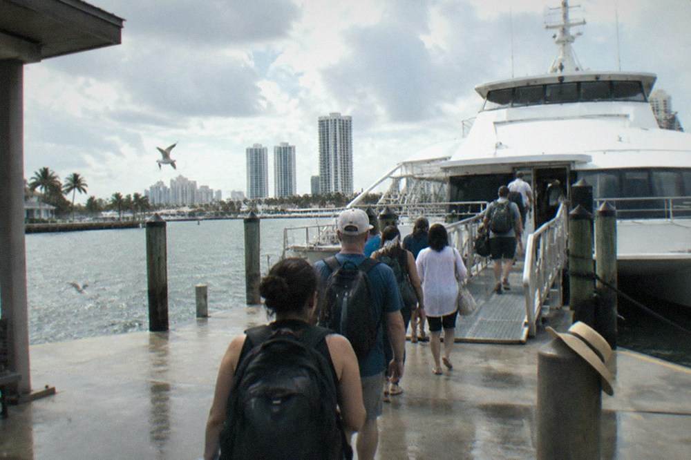 Ferry passengers boarding a catamaran at a Fort Lauderdale terminal