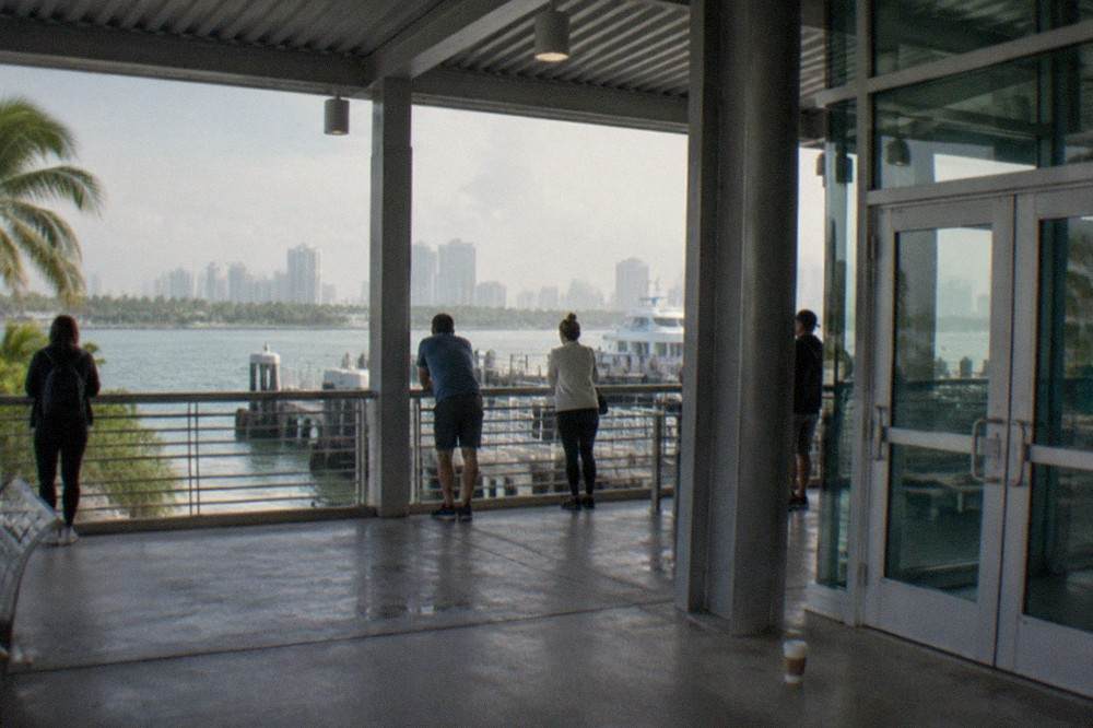 Ferry terminal building at a South Florida port with passengers waiting at the gate