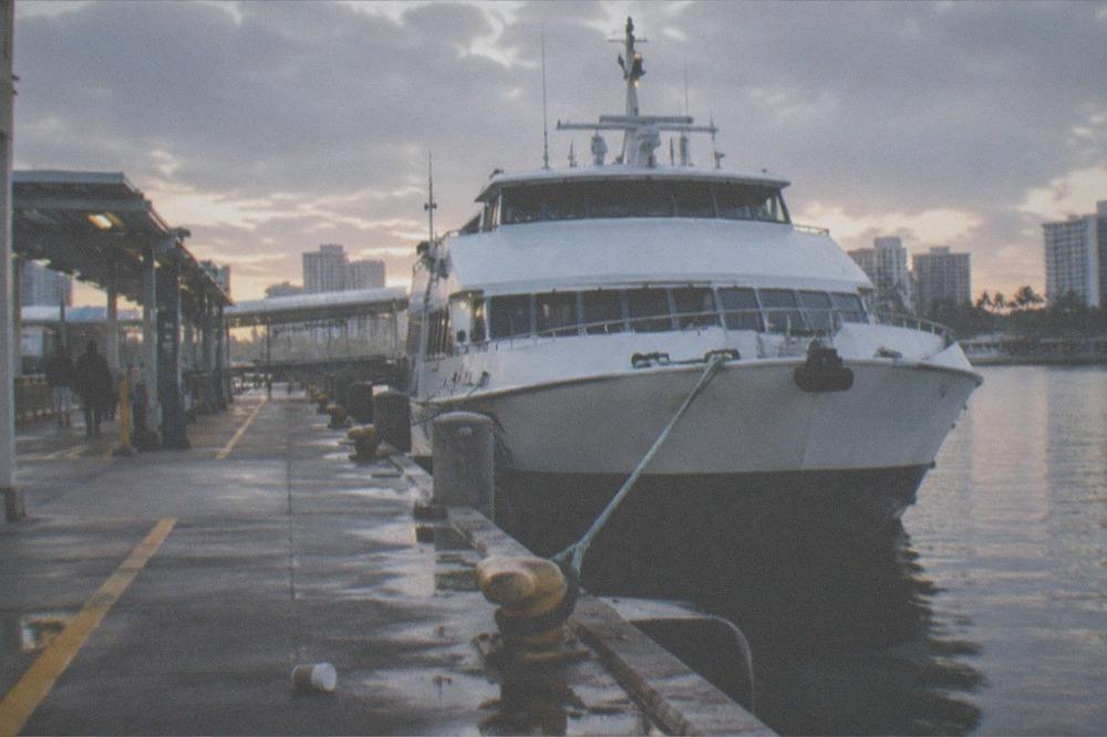 Passenger ferry at a port terminal in early morning light