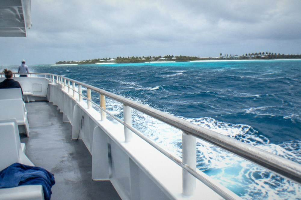 Open deck of a fast ferry with whitecaps on deep blue open water