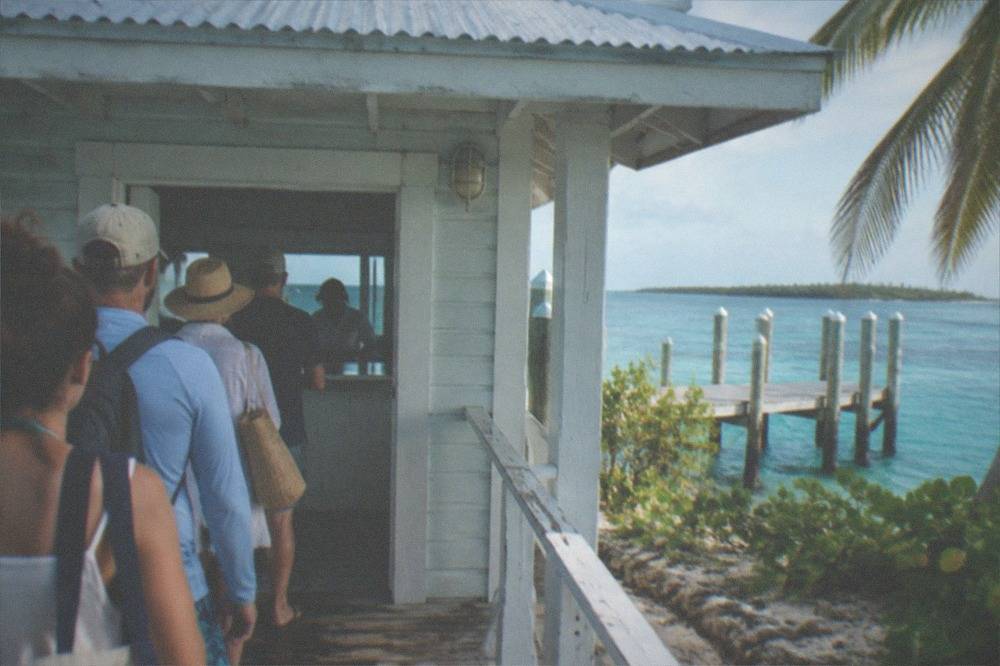 Immigration counter queue at a small island ferry terminal